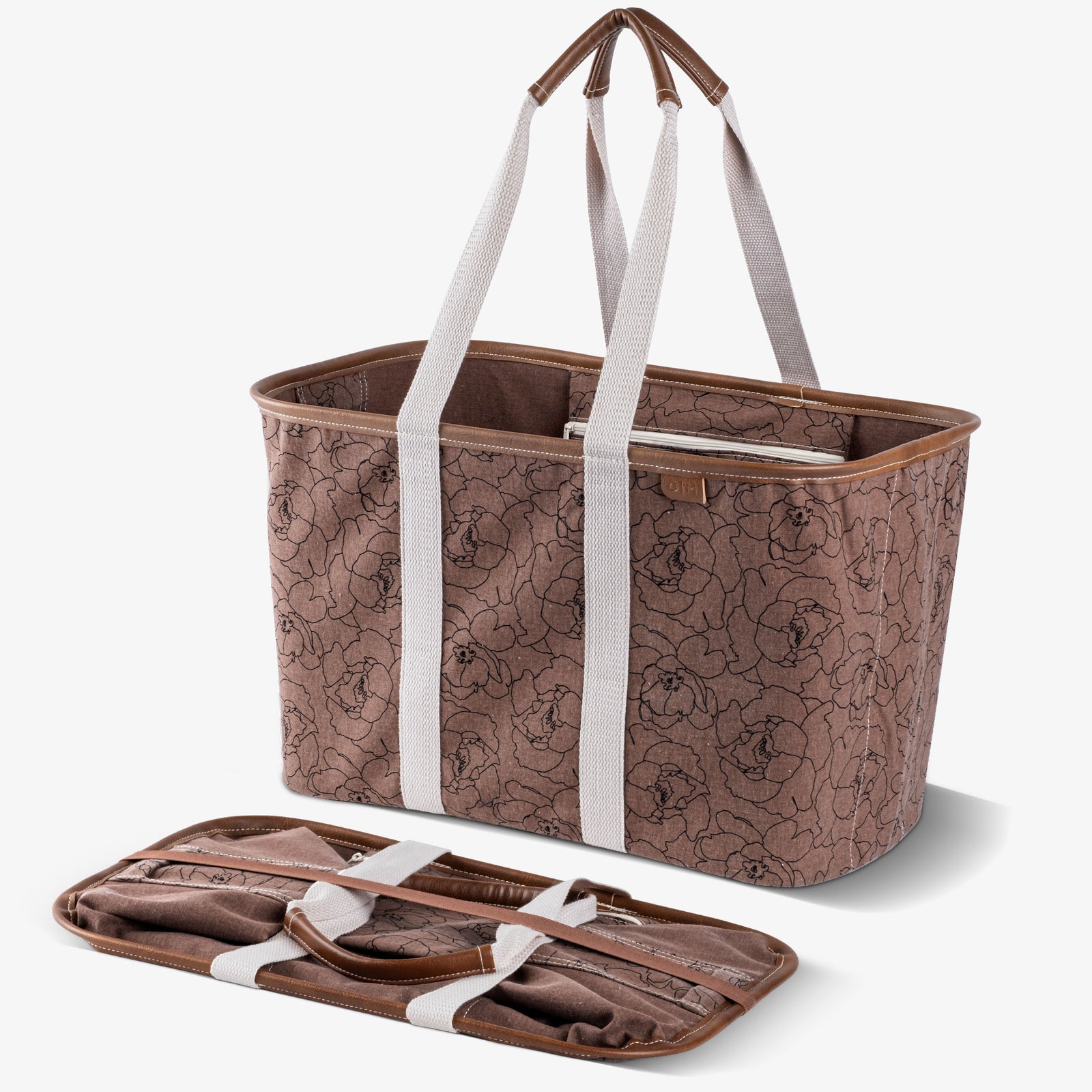 Brown floral-patterned tote bag with white straps on a white background