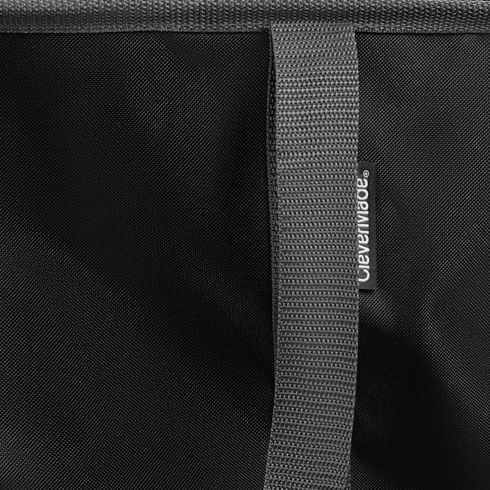 Close-up of a black bag with a gray strap and 'CleverMade' brand logo.