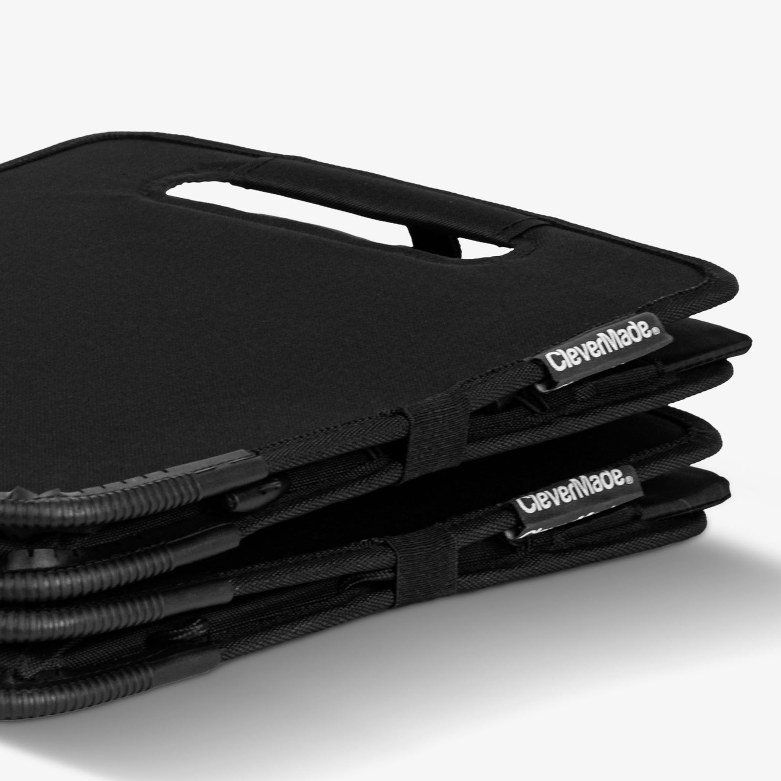 Stack of black CleverMade trunk caddy on a white background