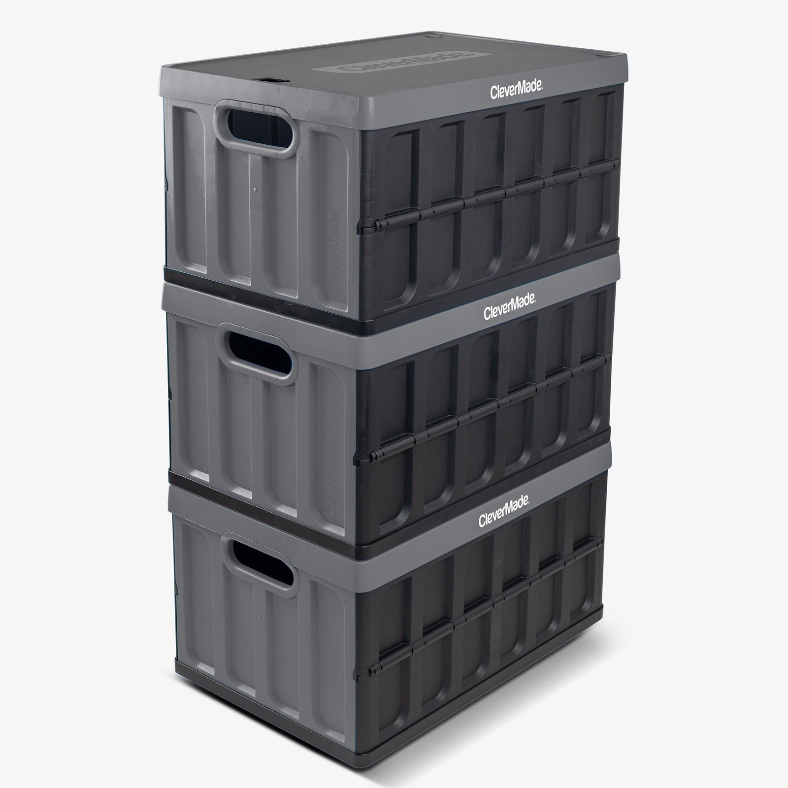 Stack of three gray and black collapsible storage bins with lids with 'CleverMade' branding on a white background