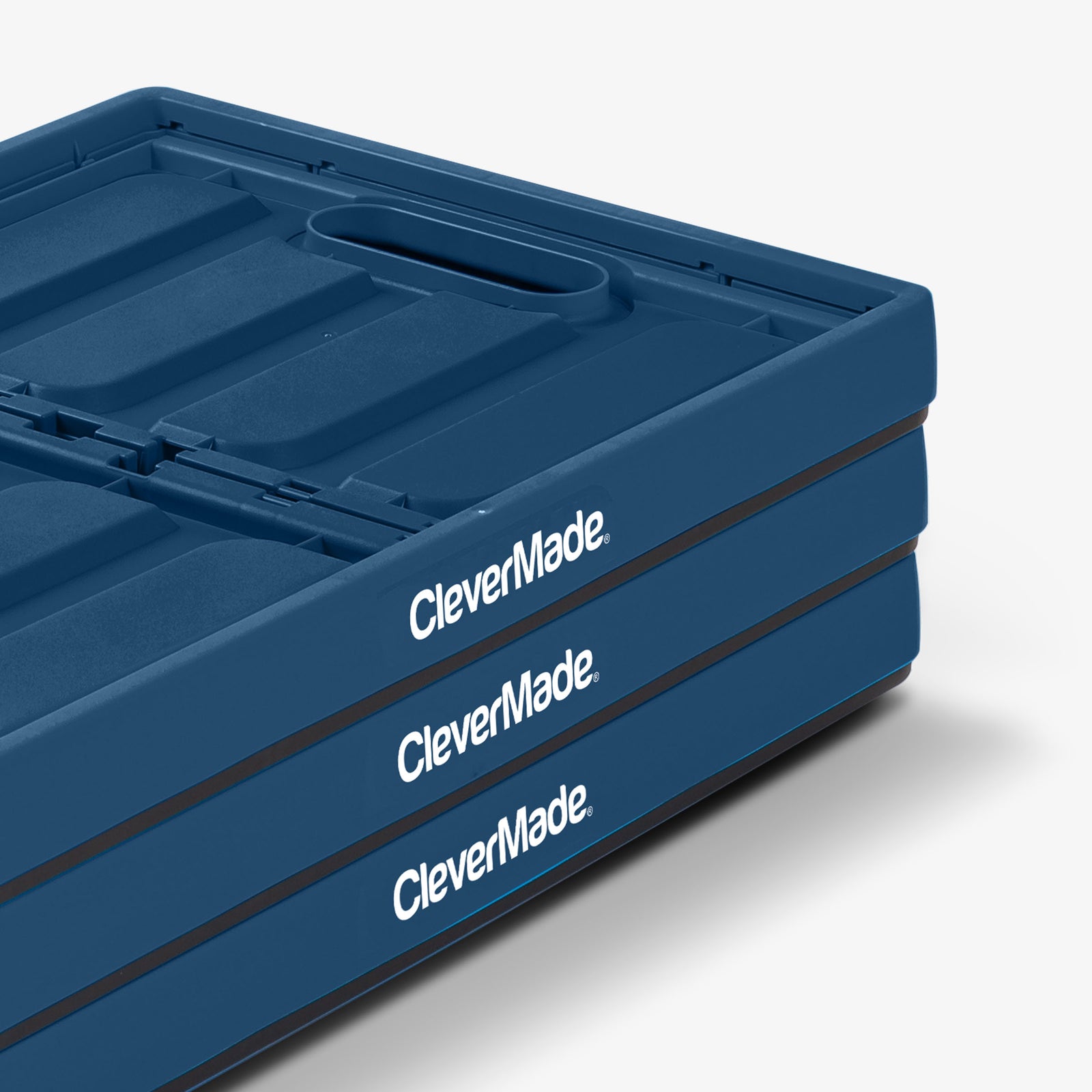 Folded three-pack blue and black collapsible storage bin with lid with 'CleverMade' branding on a white background