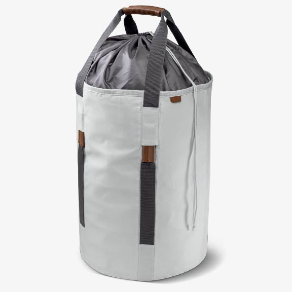Two-toned laundry backpack duffel bag with gray top and white bottom on a white background