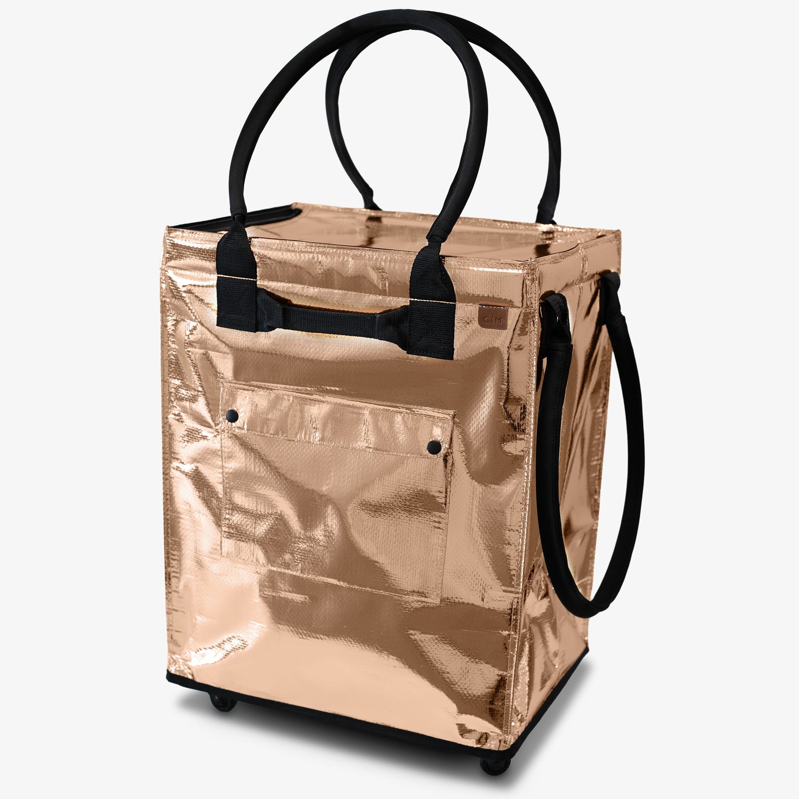 Rose gold tote bag with black handles on a white background