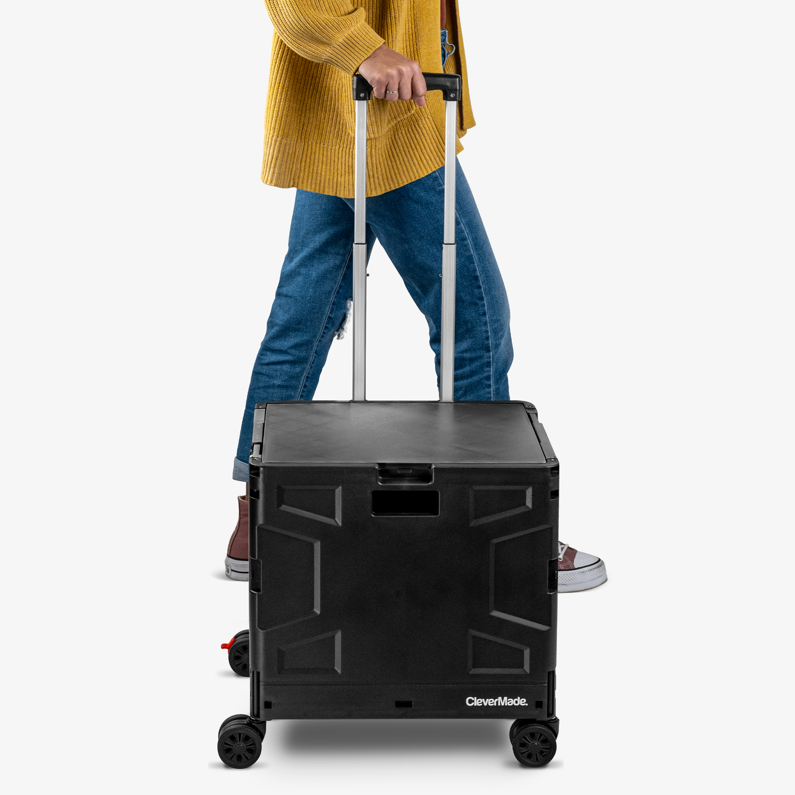 Person using a black rolling cart with 'CleverMade' branding on a white background