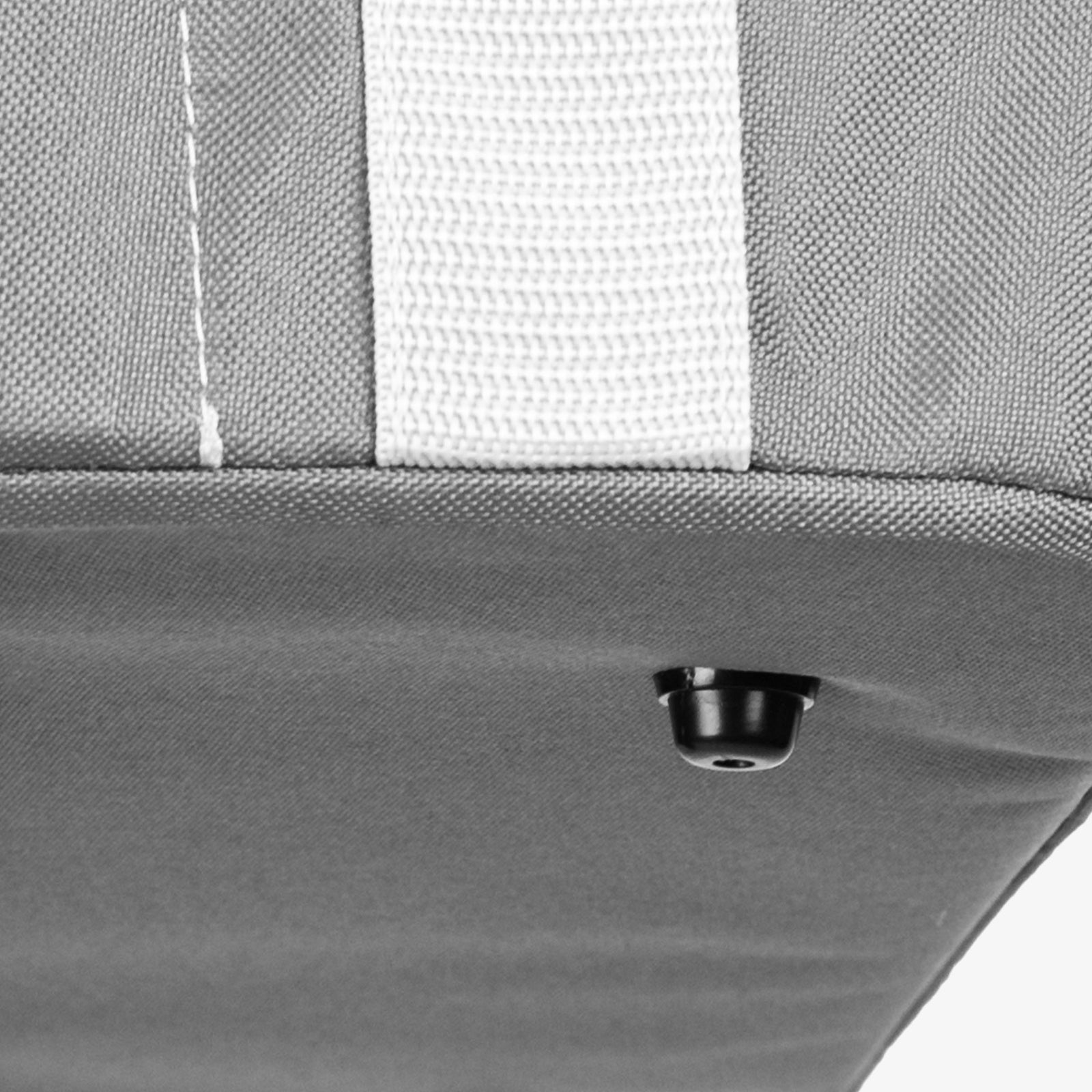 Close-up of a collapsible laundry basket with a button foot