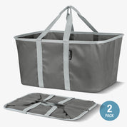 Gray folding laundry tote bag with straps on a white background