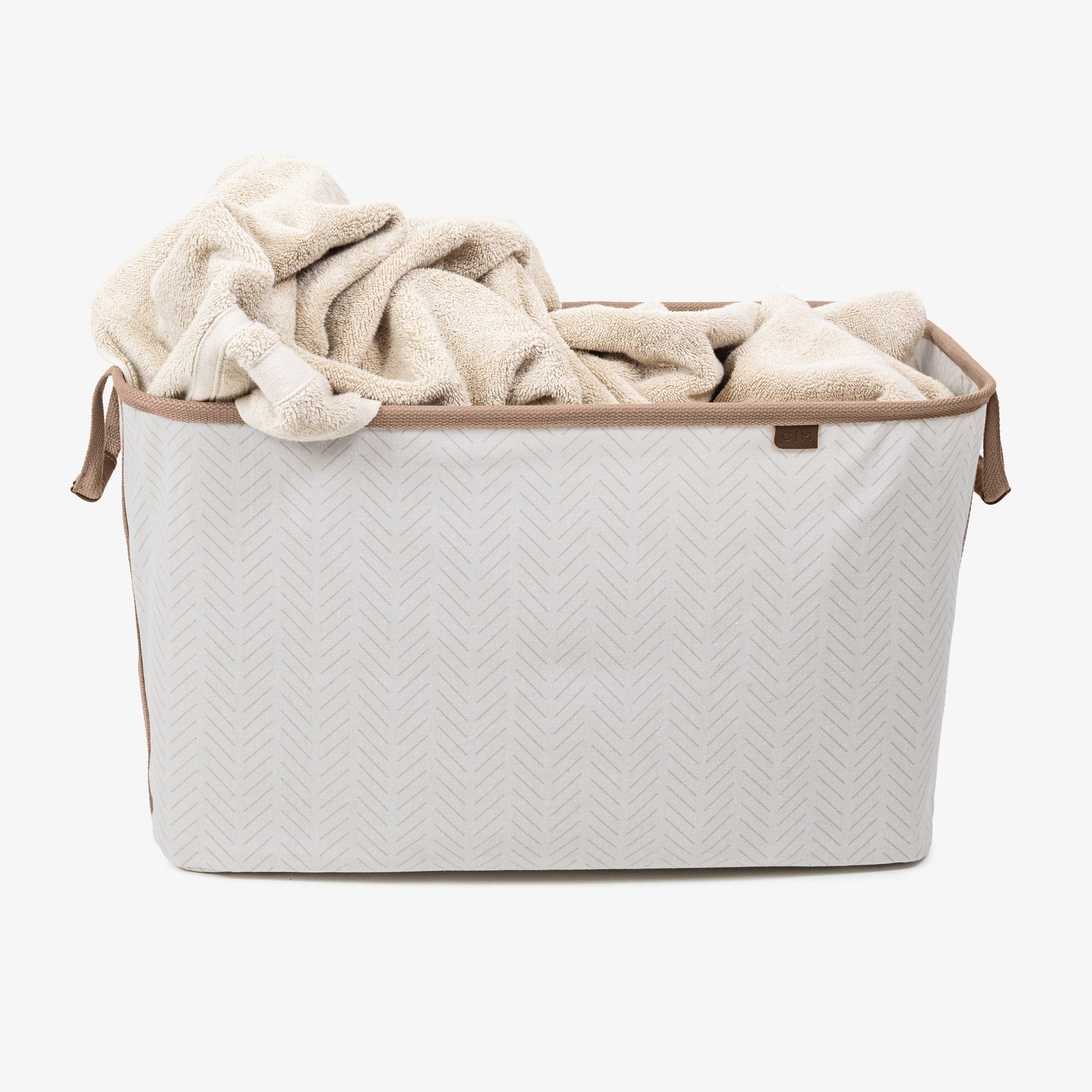 Collapsible laundry basket LUXE
 with a beige blanket on a white background