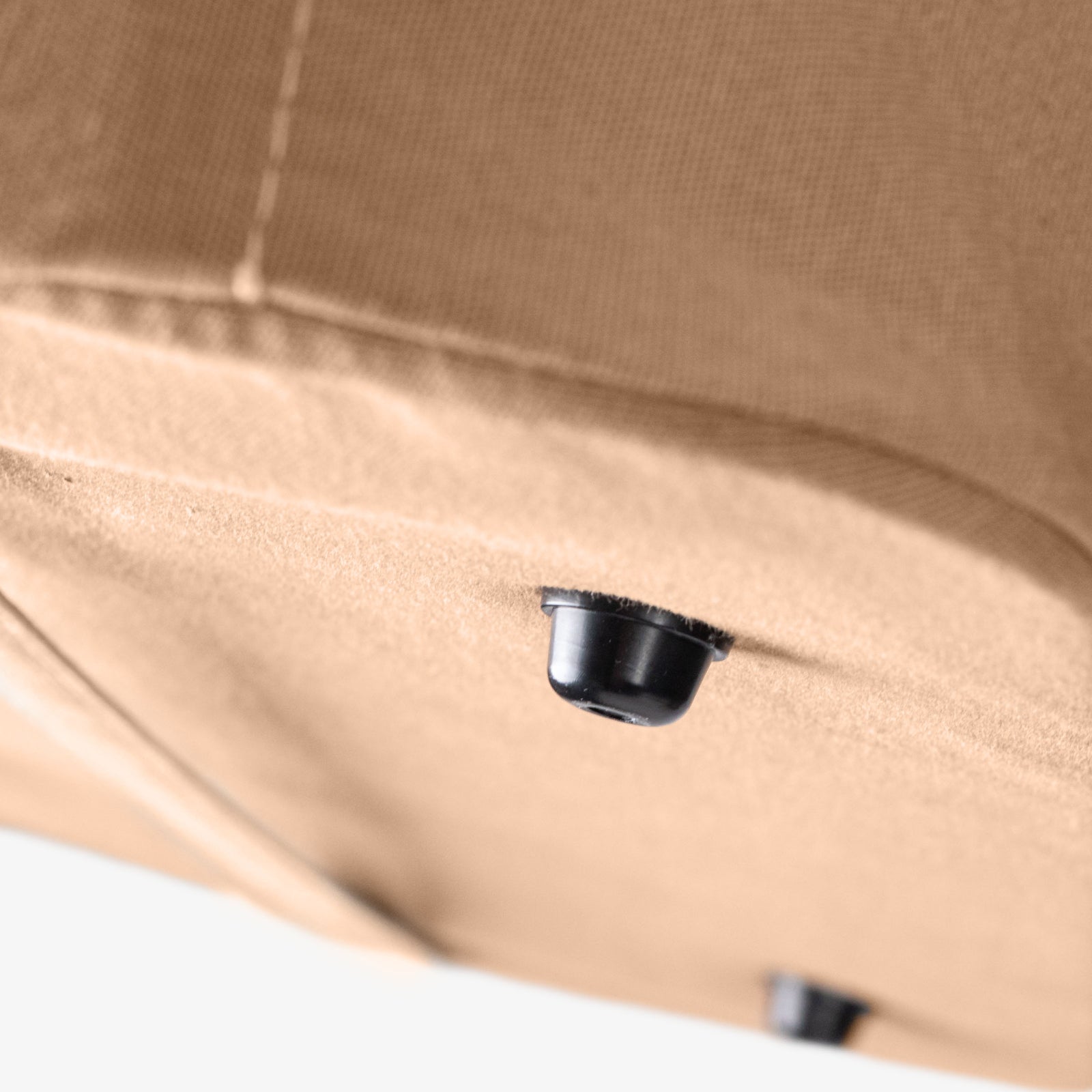 Close up collapsible laundry basket LUXE with button foot