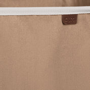 Close up collapsible laundry basket LUXE with brown brand label C|M