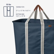 Navy tapered tote bag with brown handles on a white background