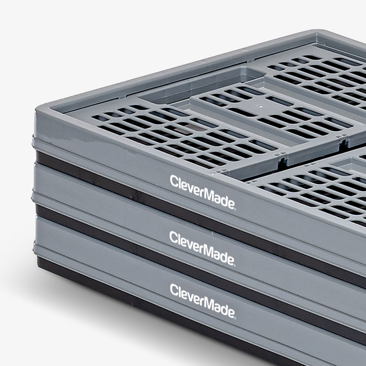 Stack of gray CleverMade collapsible containers on a white background