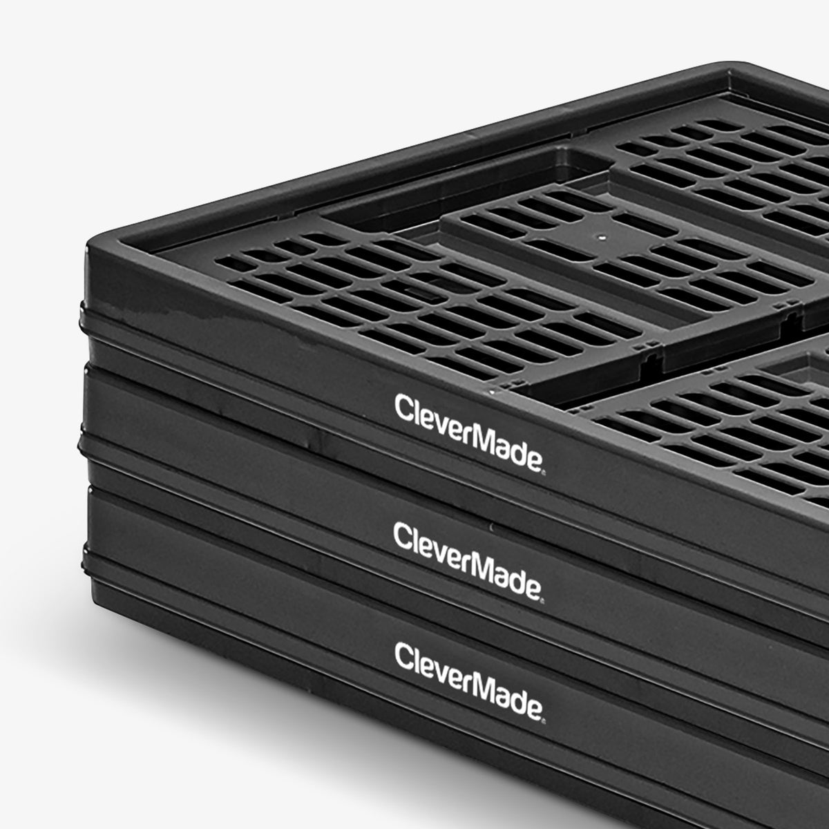 Stack of black CleverMade crates on a white background