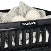 Black storage bin with cotton balls and a blanket, featuring the 'CleverMade' brand.