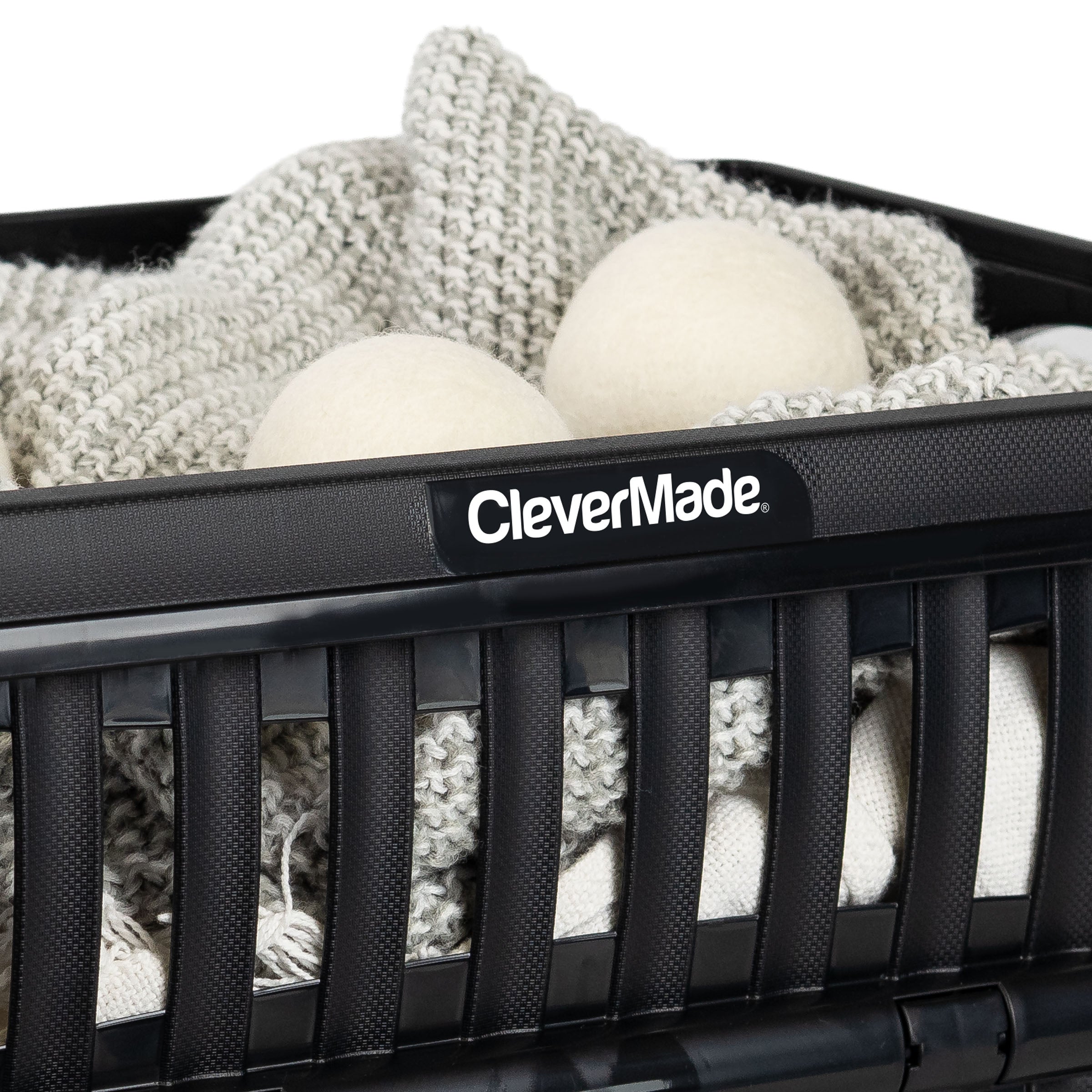 Black storage bin with cotton balls and a blanket, featuring the 'CleverMade' brand.