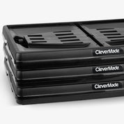 Stack of 3 folded black CleverMade Black collapsible storage crate on a white background