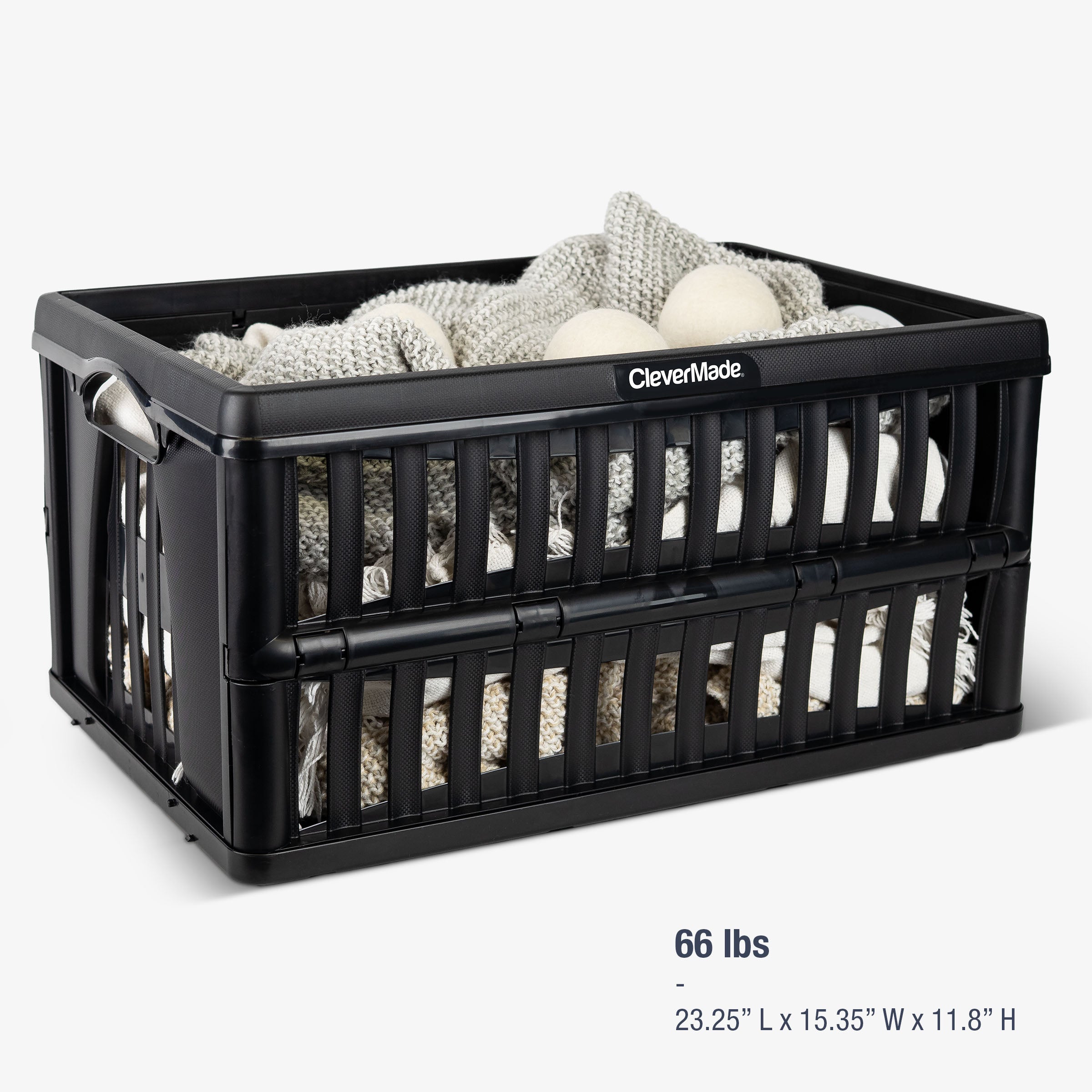 Black storage crate with contents (can carry up to 66 lbs) on a white background
