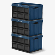 Stack of three blue storage crates with black sides on a white background