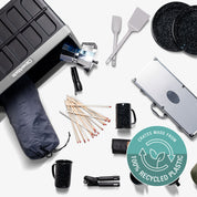 Collection of camping and outdoor cooking utensils with a Cratere branded product and recycling logo.