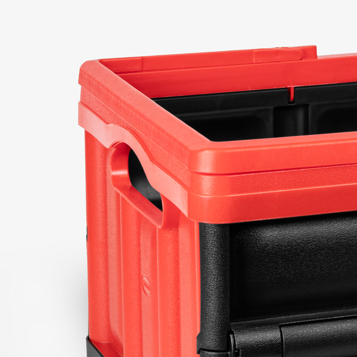 Red and black storage crate on a white background