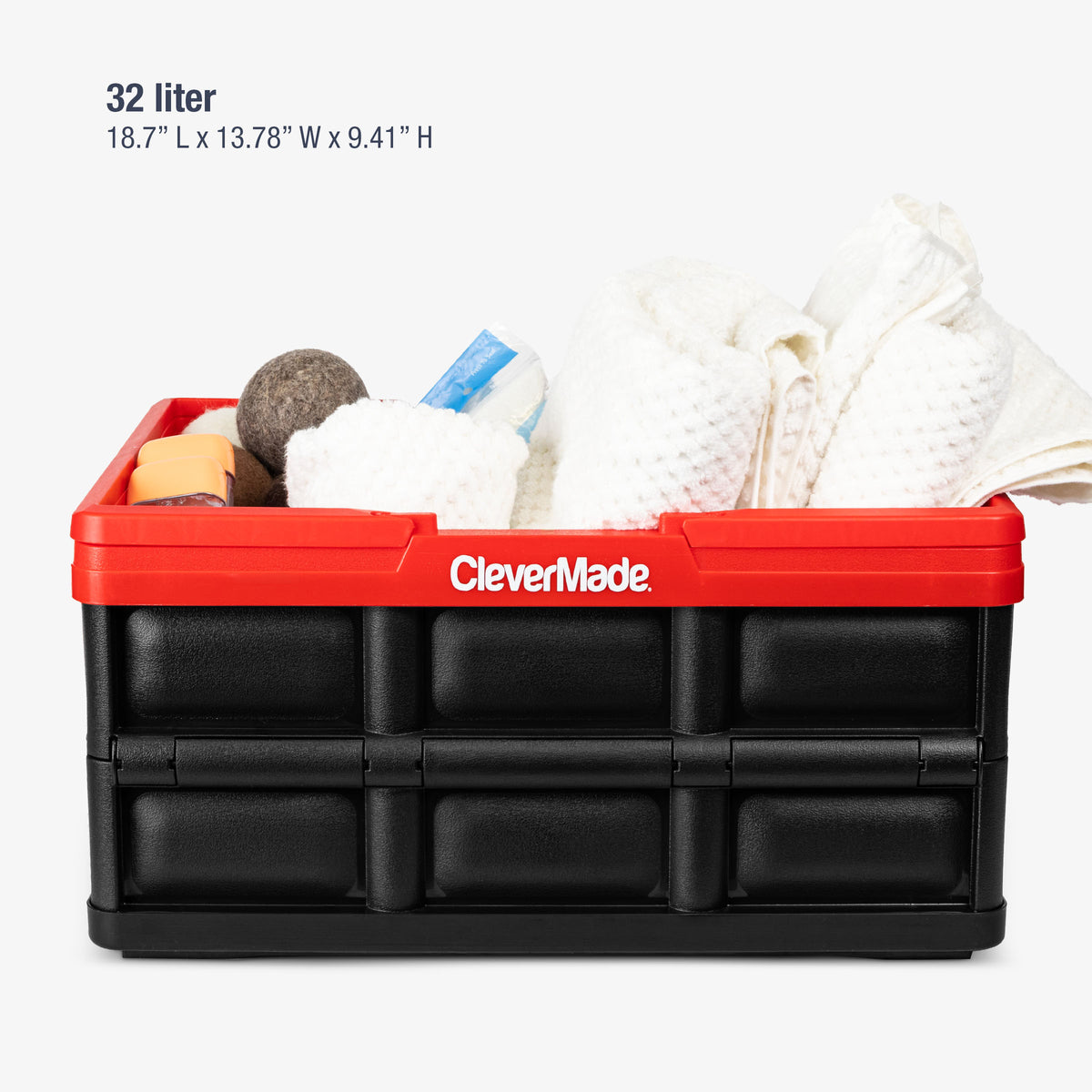 Black-Red storage bin containing household items on a white background, featuring the brand 'CleverMade'.
