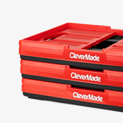 Stack of red CleverMade collapsible basket on a white background