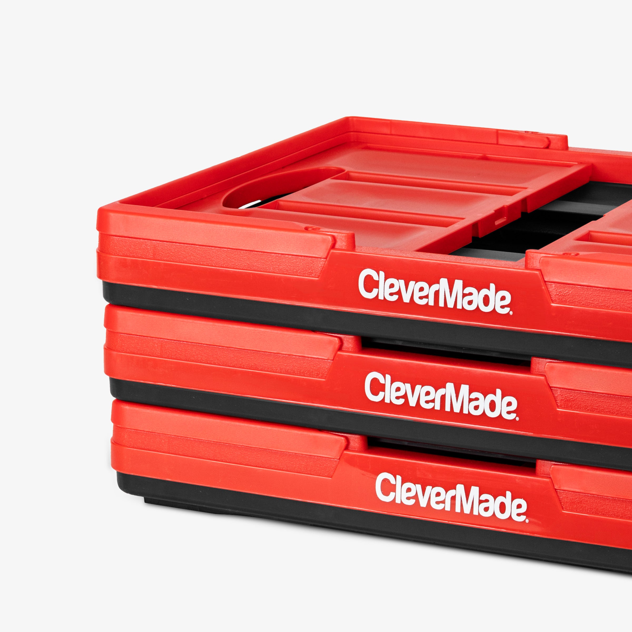 Stack of red CleverMade collapsible basket on a white background