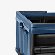 Blue and black storage crate on a white background
