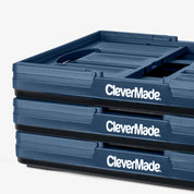 Stack of blue CleverMade trays on a white background