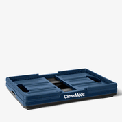 Folding Blue and black CleverMade storage bin with a handle on a white background