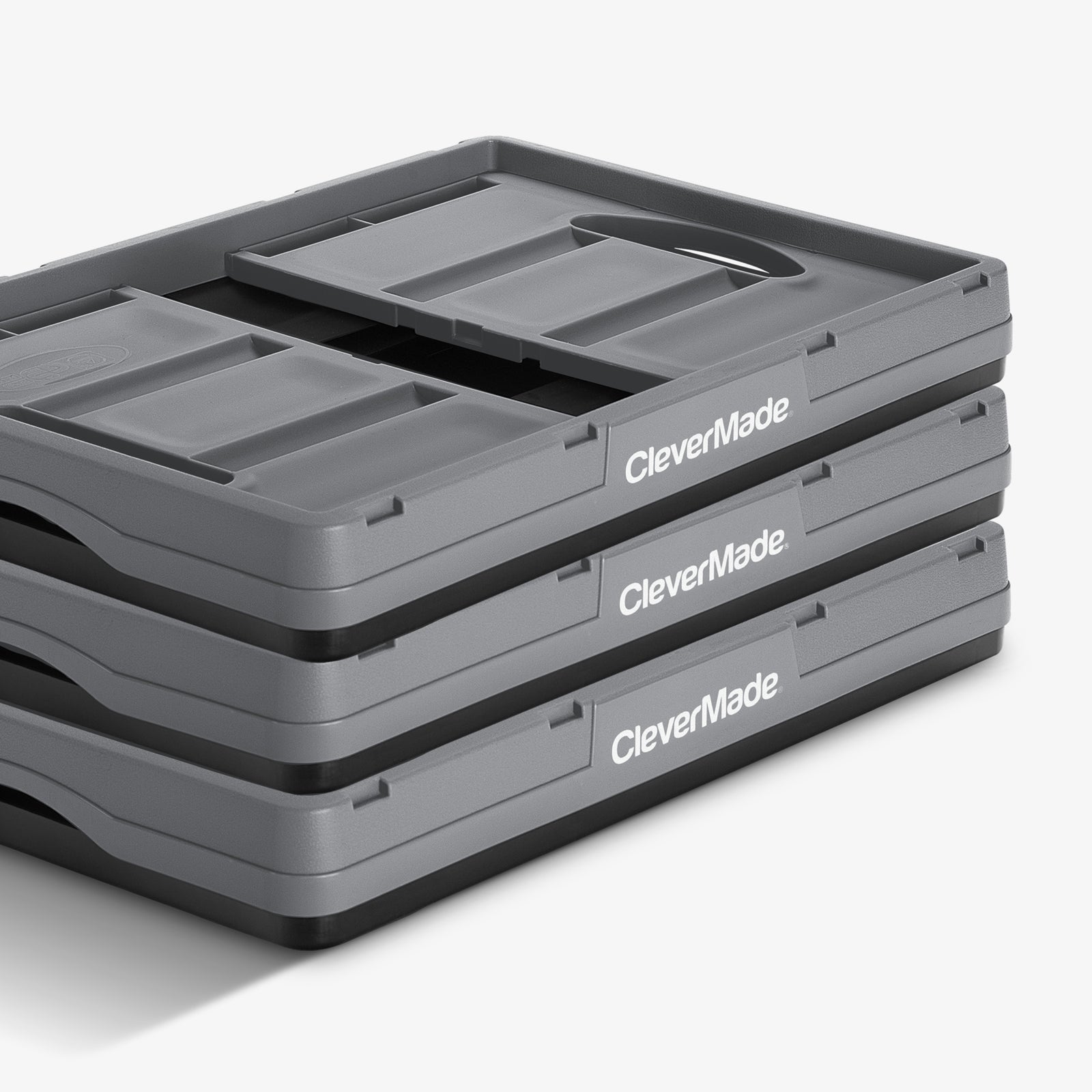 Folded three-pack gray-black stackable collapsible storage bin with CleverMade logo