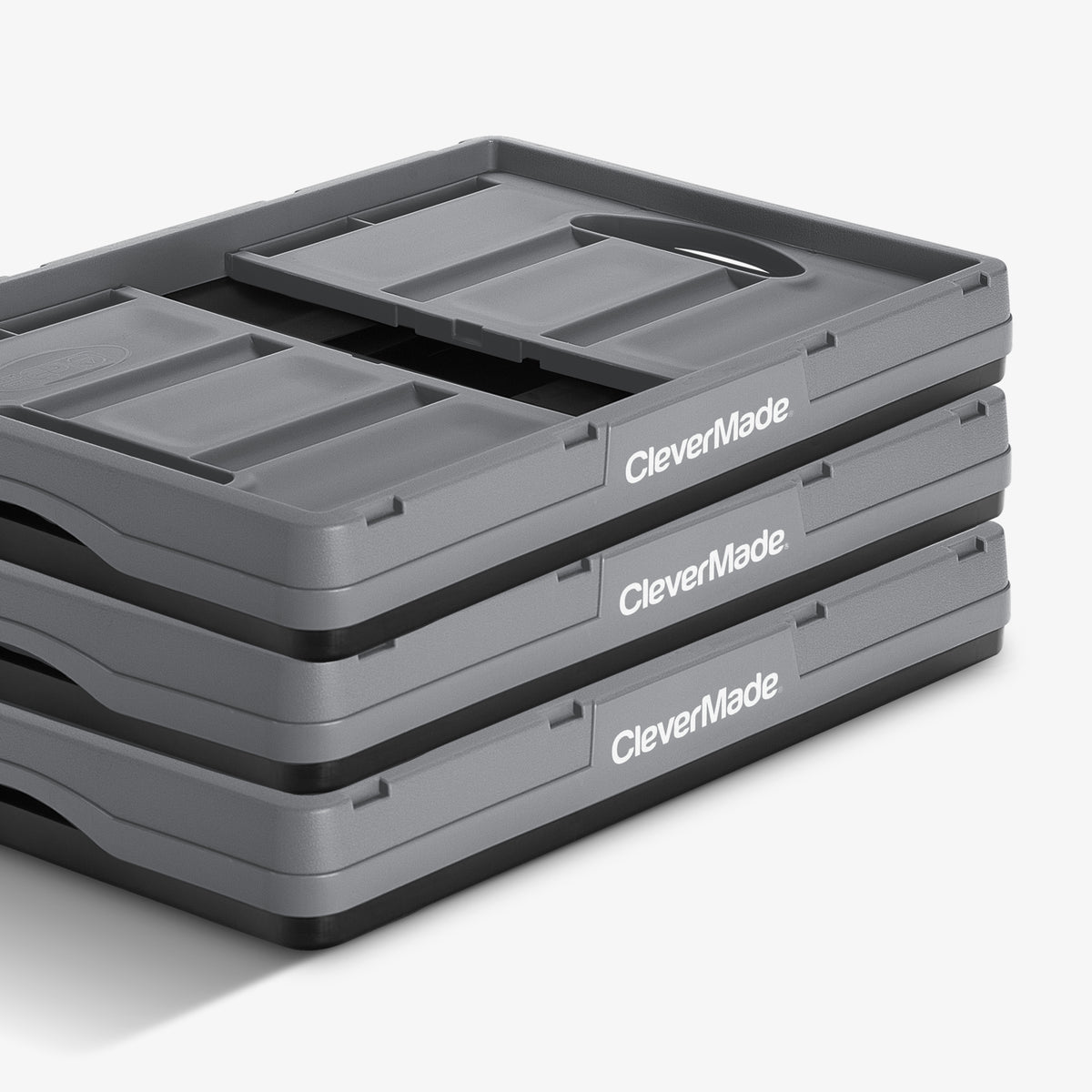 Folded three-pack gray-black stackable collapsible storage bin with CleverMade logo