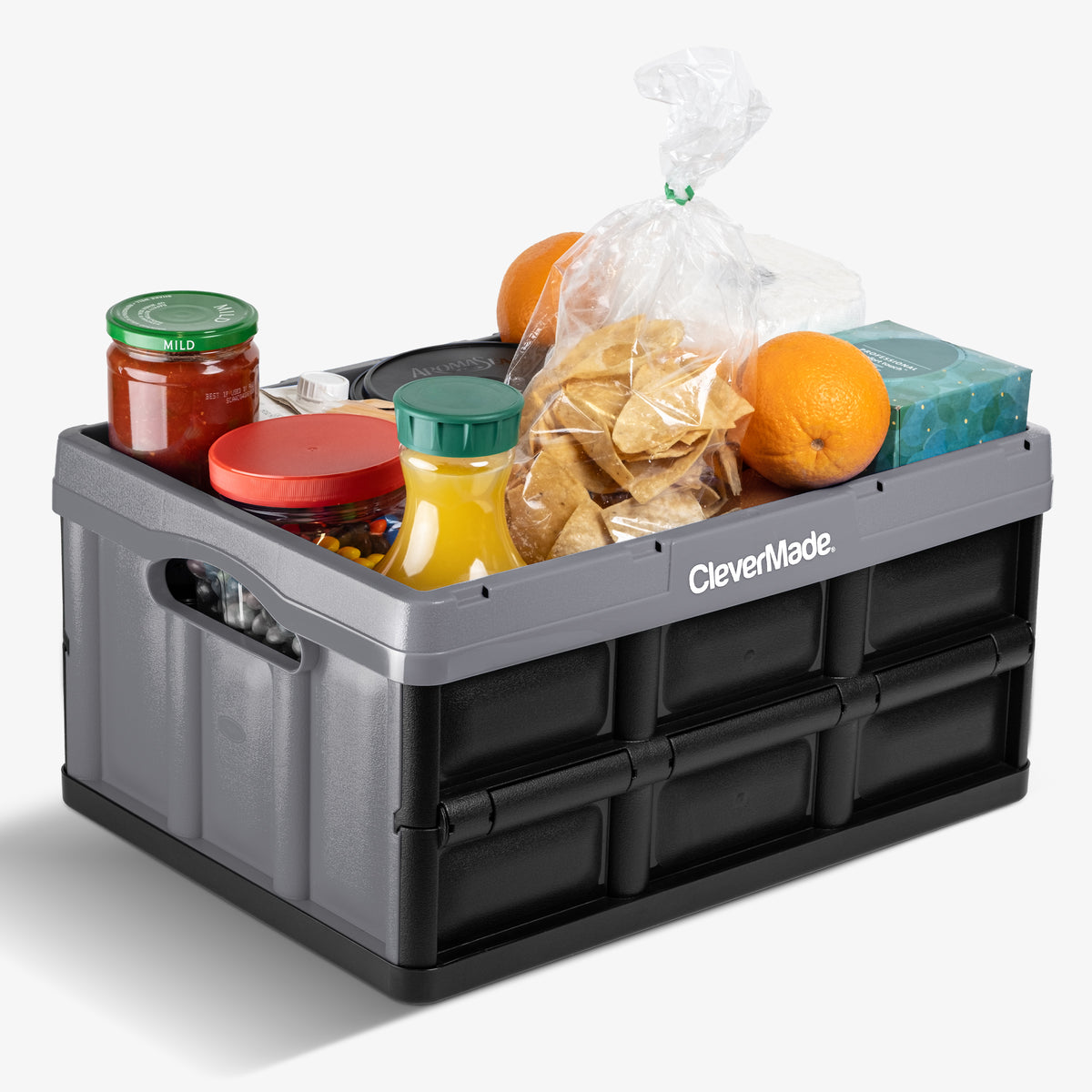 A gray-black collapsible storage bin for carrying groceries