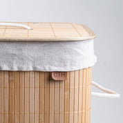Close up view, cover of collapsible bamboo laundry hamper with a lid and handles