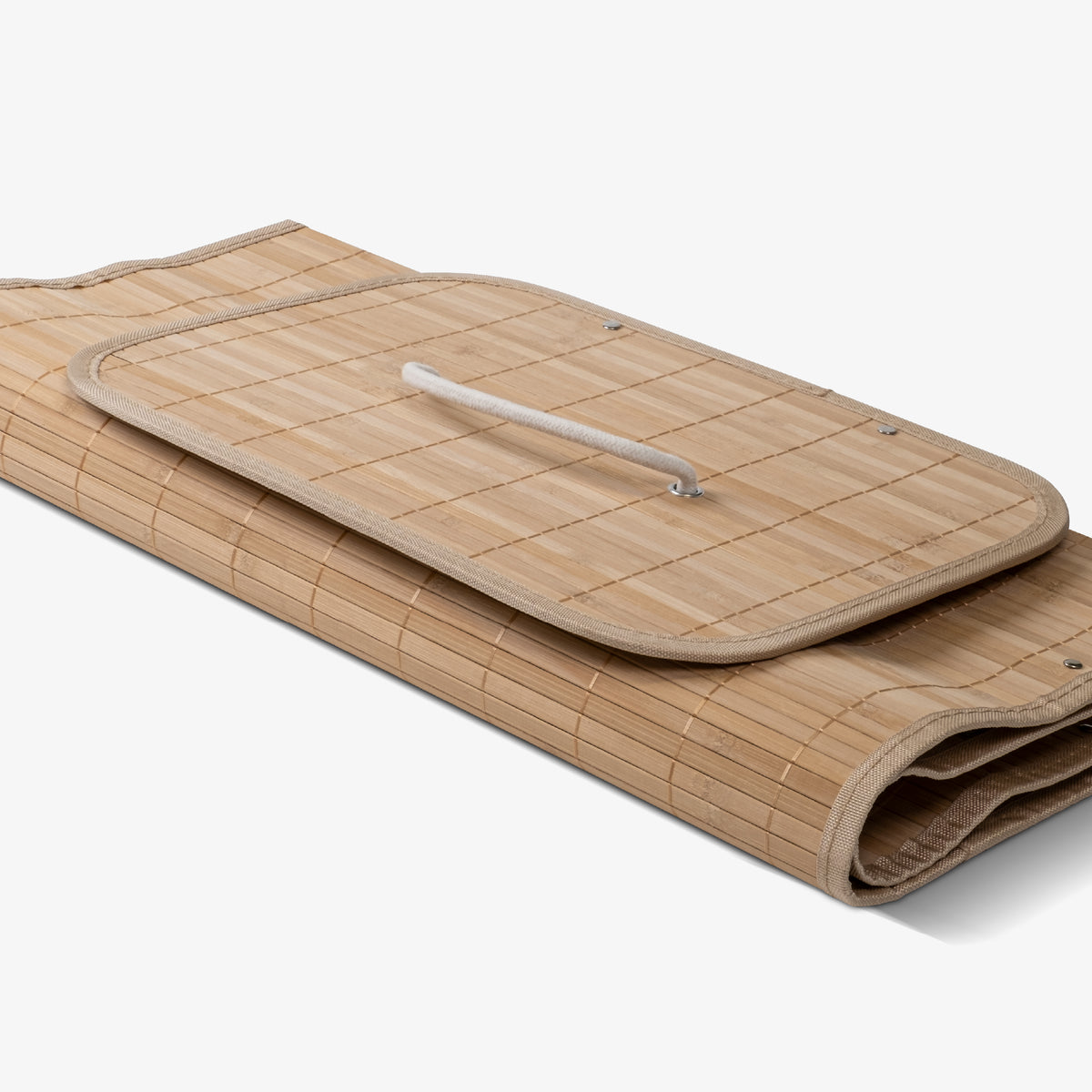 Folded collapsible bamboo laundry hamper with a lid and handles, featuring a natural beige color.