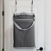 Gray over-the-door hanging storage bag on a white door