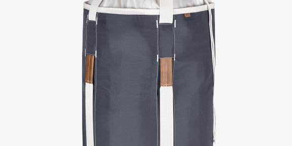 Gray laundry backpack duffel bag with white drawstring top and brown handles on a white background