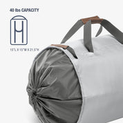 Gray laundry backpack duffel bag 
with white drawstring and brown handles on a white background