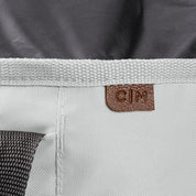 Close-up of a laundry backpack duffel bag with a visible brand label C|M on a white background