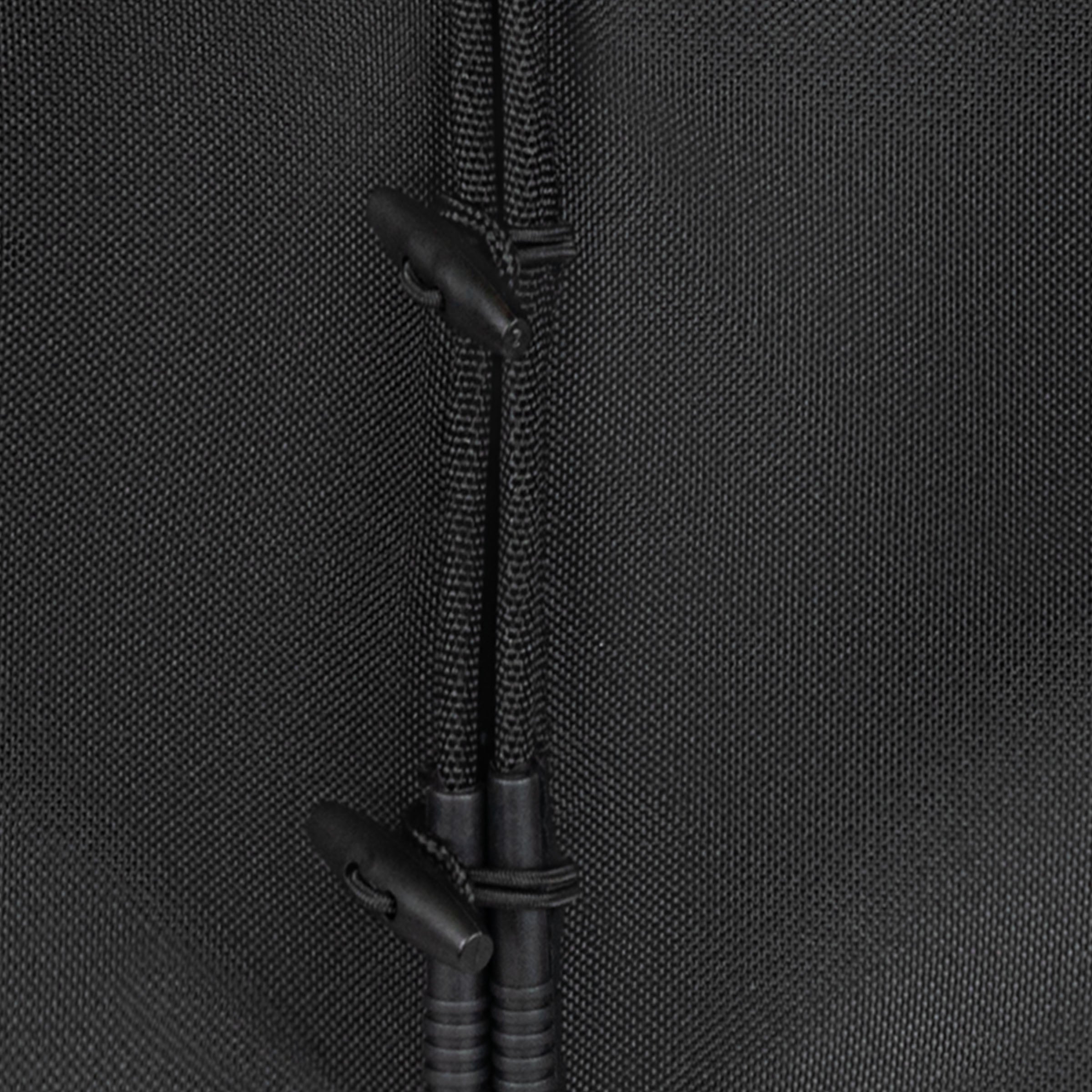 Close-up of a black connector on a textured black fabric