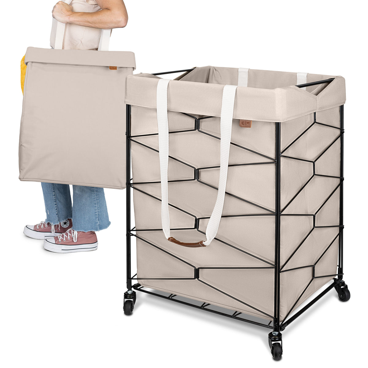 Beige laundry basket with geometric design and wheels, held by a person.