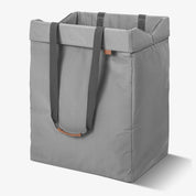 Gray tote bag with handles on a white background