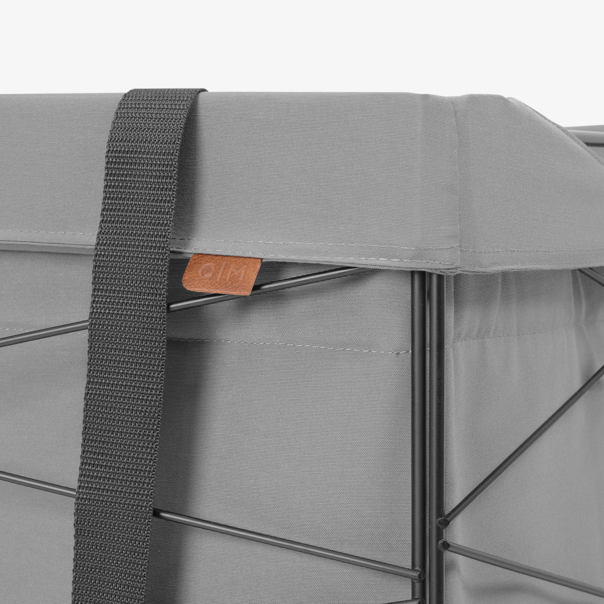 Gray bag with a strap and visible brand logo on a white background