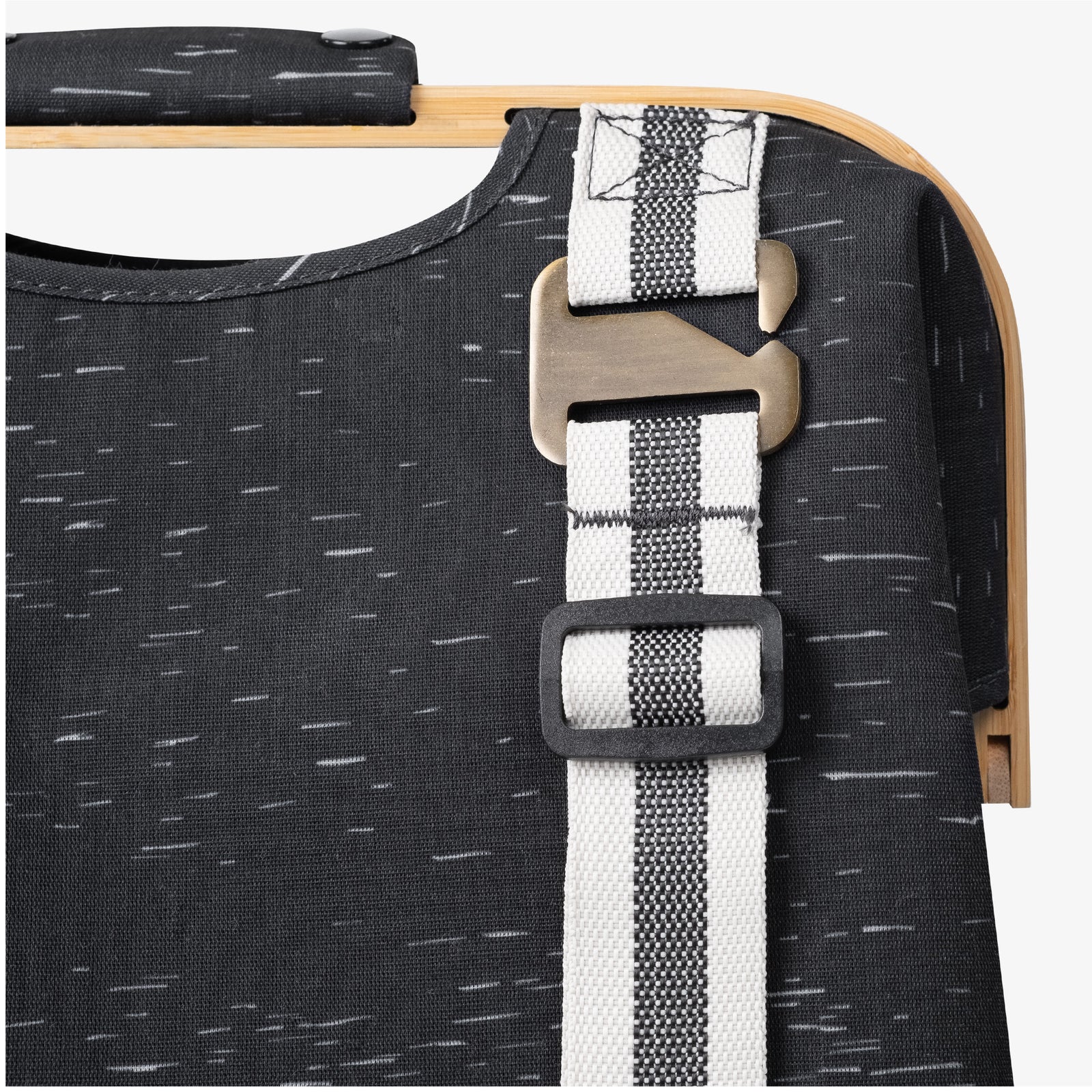 Close up of reinforced straps and hardware of CleverMade laundry backpack LUXE