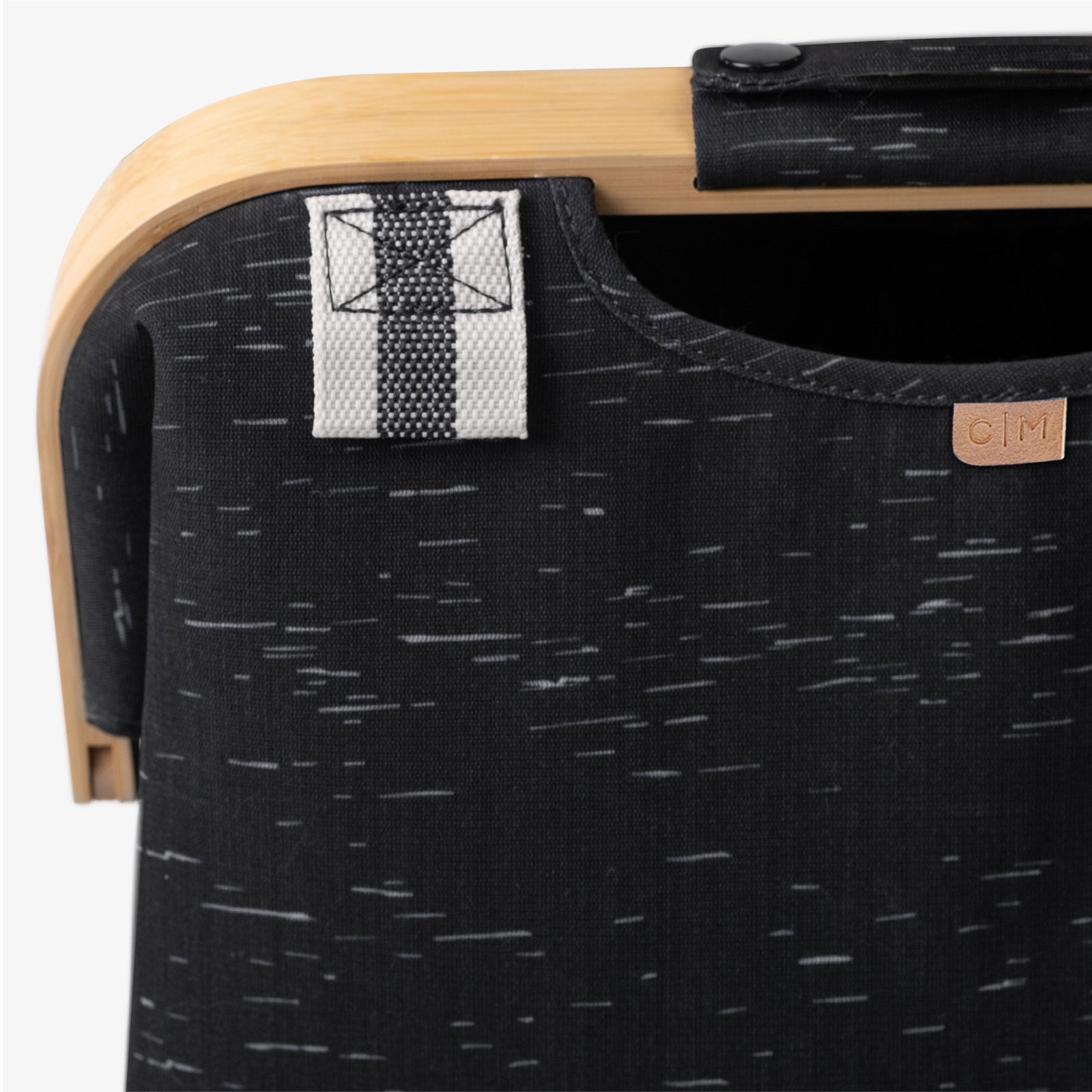 Close up of reinforced straps of CleverMade laundry backpack LUXE