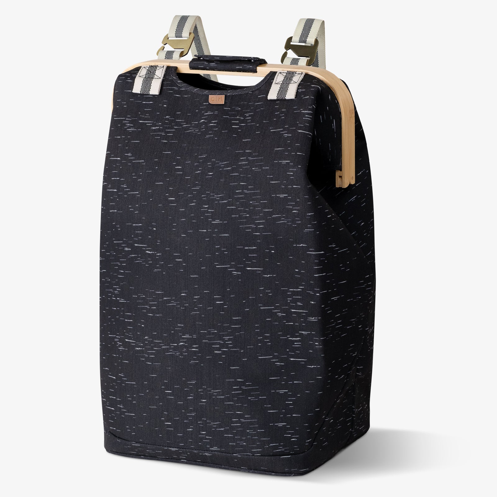 A black laundry backpack with a dotted pattern, featuring two straps and a zipper closure.