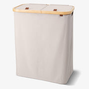 Cream double laundry basket with wooden handle on a white background