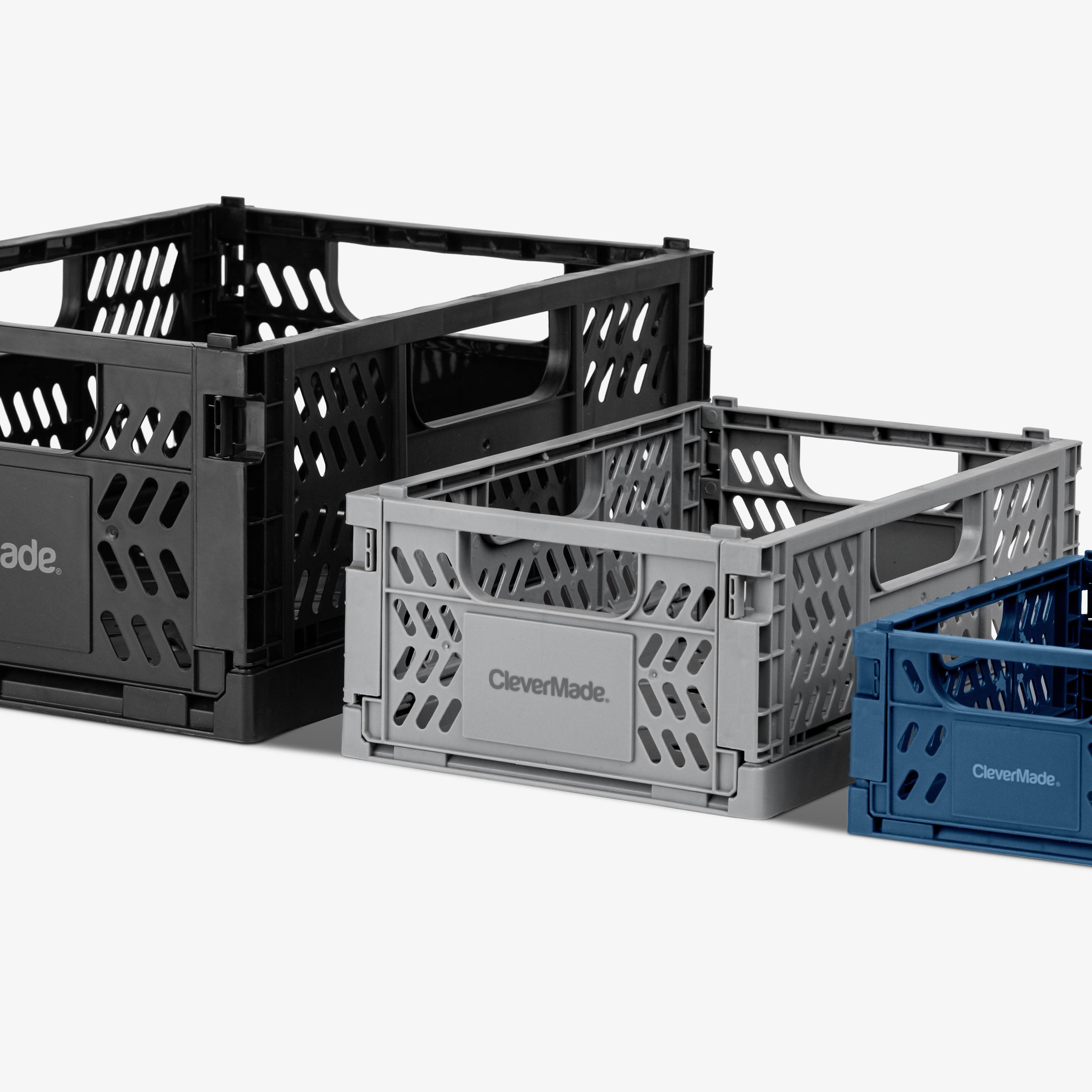 Three mini collapsible storage crates in black, gray, and blue on a white background with 'CleverMade' branding.
