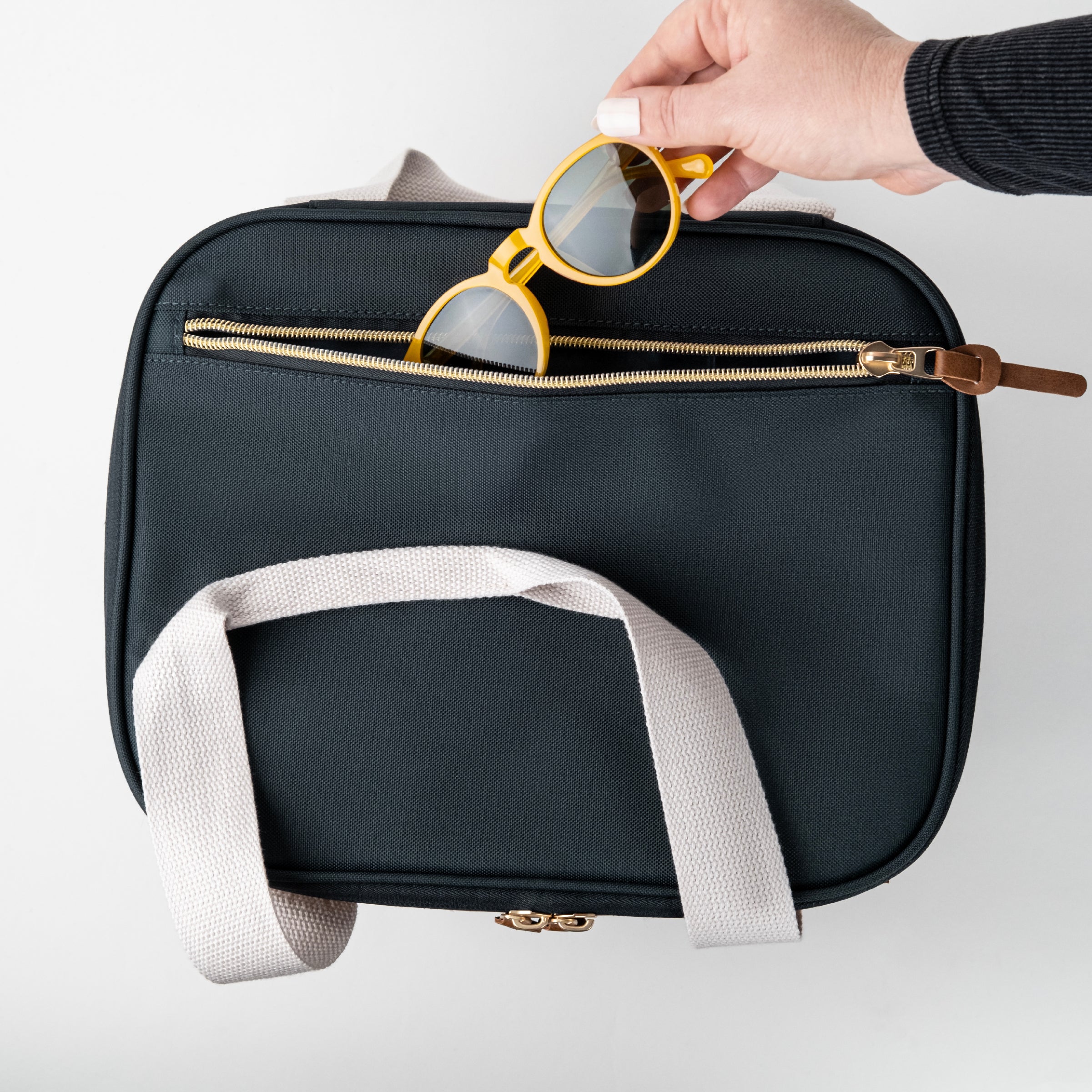 Malibu collapsible cooler bag has back pocket where you can keep your sunglasses