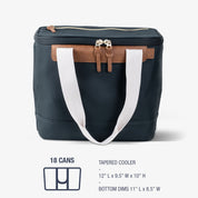 Navy cooler bag with brown accents and white handles on a light gray background