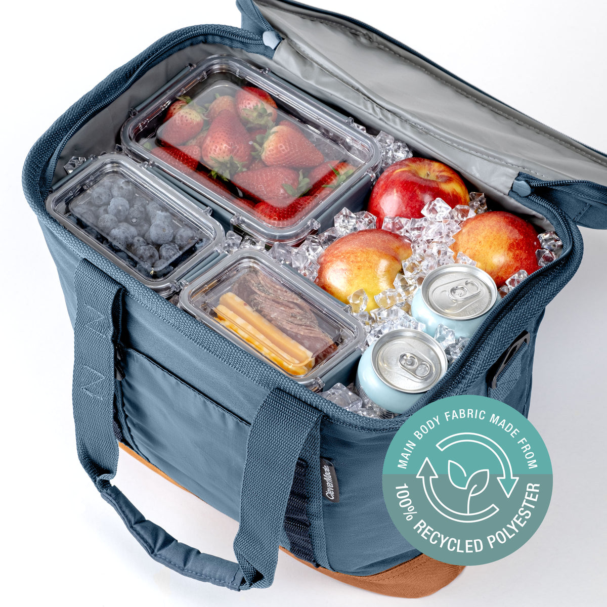 Blue cooler bag with food items and a label indicating 100% recycled polyester.